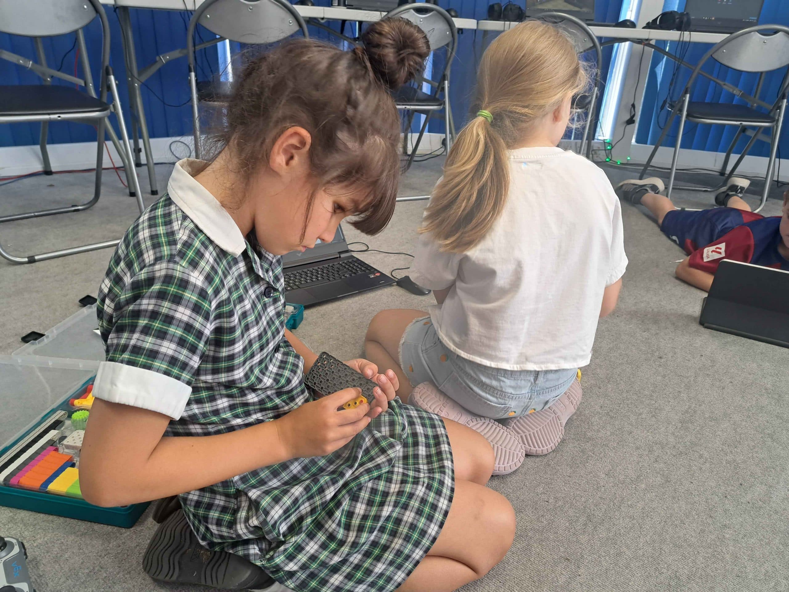 Kids gaming and coding during a Player Ready club session